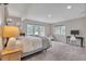 This bedroom features soft carpet, a large window, and neutral decor at 7597 Molas Ct, Larkspur, CO 80118