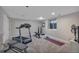 Bright gym with treadmill, weights, carpet and good lighting at 7597 Molas Ct, Larkspur, CO 80118