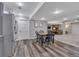 Kitchen with stainless steel appliances, grey cabinets and a view into the living room at 7597 Molas Ct, Larkspur, CO 80118