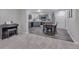 Charming kitchen with stainless steel appliances, gray cabinetry and wood floors next to a music area at 7597 Molas Ct, Larkspur, CO 80118