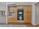 Kitchen features double oven, granite countertops, natural wood cabinets and hardwood flooring at 7597 Molas Ct, Larkspur, CO 80118