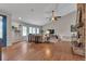 Bright living room with vaulted ceilings, hardwood floors, and a large window at 7597 Molas Ct, Larkspur, CO 80118