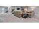Open-concept living space with fireplace, comfortable seating and access to backyard at 7597 Molas Ct, Larkspur, CO 80118