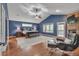 The main bedroom is bright, spacious, and features hardwood floors and an ensuite bathroom at 7597 Molas Ct, Larkspur, CO 80118