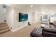 Finished basement with large screen TV, game table, and seating at 2975 Thunder Lake Cir, Lafayette, CO 80026