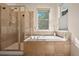Bathroom with walk-in shower and soaking tub at 2975 Thunder Lake Cir, Lafayette, CO 80026
