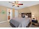 Bright bedroom with a ceiling fan, en-suite bathroom access, and ample closet space at 2975 Thunder Lake Cir, Lafayette, CO 80026