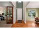Bright and spacious entryway with hardwood floors and views into an office and living area at 2975 Thunder Lake Cir, Lafayette, CO 80026