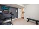 Basement home gym with treadmill and weight bench at 2975 Thunder Lake Cir, Lafayette, CO 80026