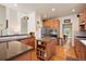 Modern kitchen with granite countertops and wood cabinets at 2975 Thunder Lake Cir, Lafayette, CO 80026