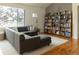 Living room with sectional sofa and built-in shelving at 2975 Thunder Lake Cir, Lafayette, CO 80026