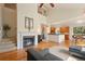 Open concept living room with kitchen and fireplace at 2975 Thunder Lake Cir, Lafayette, CO 80026