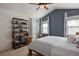 Main bedroom with vaulted ceiling, wood bed frame, and built-in shelving at 2975 Thunder Lake Cir, Lafayette, CO 80026