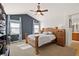 Spacious main bedroom with vaulted ceiling, wood bed frame, and ample natural light at 2975 Thunder Lake Cir, Lafayette, CO 80026