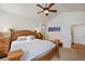 Main bedroom with vaulted ceiling, wood bed frame and access to other rooms at 2975 Thunder Lake Cir, Lafayette, CO 80026