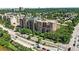 A beautiful aerial view showcasing a brick condominium with green surroundings in a residential neighborhood at 2400 E Cherry Creek South Dr # 307, Denver, CO 80209