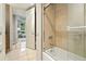 Bathroom with large bathtub and neutral tile at 2400 E Cherry Creek South Dr # 307, Denver, CO 80209