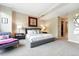 Calming bedroom with a seating area and view to an ensuite bathroom at 2400 E Cherry Creek South Dr # 307, Denver, CO 80209