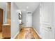 Hallway featuring hardwood floors and neutral walls at 2400 E Cherry Creek South Dr # 307, Denver, CO 80209