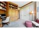 Home office featuring built-in bookshelves, desk, and seating area at 2400 E Cherry Creek South Dr # 307, Denver, CO 80209