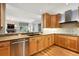 Elegant kitchen featuring hardwood floors, granite countertops, and stainless steel appliances at 2400 E Cherry Creek South Dr # 307, Denver, CO 80209