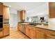 Charming kitchen featuring granite countertops, stainless steel appliances and view to the living room at 2400 E Cherry Creek South Dr # 307, Denver, CO 80209