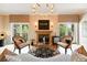 Bright living room featuring hardwood floors, fireplace, and modern decor at 2400 E Cherry Creek South Dr # 307, Denver, CO 80209