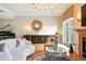 Bright living room featuring hardwood floors, piano, fireplace, and modern decor at 2400 E Cherry Creek South Dr # 307, Denver, CO 80209