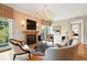 Cozy living room with fireplace, hardwood floors, and balcony access at 2400 E Cherry Creek South Dr # 307, Denver, CO 80209