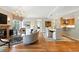 Open-concept living space with fireplace, dining area, and hardwood floors at 2400 E Cherry Creek South Dr # 307, Denver, CO 80209