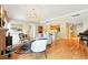 Bright living area with open kitchen, hardwood floors, and stylish furnishings at 2400 E Cherry Creek South Dr # 307, Denver, CO 80209