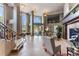 Spacious lobby featuring tall windows, a fireplace, and comfortable seating for a luxurious experience at 2400 E Cherry Creek South Dr # 307, Denver, CO 80209