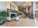 Elegant lobby with a fireplace, high ceilings, and a grand staircase, creating a welcoming atmosphere at 2400 E Cherry Creek South Dr # 307, Denver, CO 80209