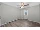 Well-lit bedroom featuring a ceiling fan and wood-look floors at 4795 S Yank Way, Morrison, CO 80465