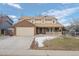 Brick two-story house with attached garage and landscaped yard at 4795 S Yank Way, Morrison, CO 80465