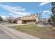 Two-story house with a large yard and wooden fence at 4795 S Yank Way, Morrison, CO 80465