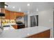 Modern kitchen featuring stainless steel appliances and white countertops at 4795 S Yank Way, Morrison, CO 80465