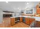 Modern kitchen with island, stainless steel appliances, and hardwood floors at 4795 S Yank Way, Morrison, CO 80465