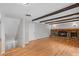 Living room featuring hardwood floors and a brick fireplace at 4795 S Yank Way, Morrison, CO 80465