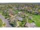 Sprawling neighborhood featuring mature trees, green lawns, and diverse housing styles at 10490 W 78Th Ave, Arvada, CO 80005