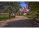 Charming brick home with mature trees, large front yard, and private driveway at 10490 W 78Th Ave, Arvada, CO 80005