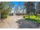 Attractive ranch home with attached garage, brick facade, and generous front yard with mature trees at 10490 W 78Th Ave, Arvada, CO 80005