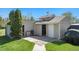 Outbuilding/shed featuring an open door and concrete pad at 10490 W 78Th Ave, Arvada, CO 80005