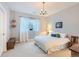 Bright bedroom with ample natural light, a chandelier, and neutral decor for a peaceful retreat at 3346 Red Tree Pl, Castle Rock, CO 80104