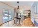 Bright kitchen with a center island, stainless steel appliances, and a sliding door to the deck at 3346 Red Tree Pl, Castle Rock, CO 80104