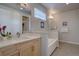 Bright bathroom features a double vanity, soaking tub with decorative tile, and lots of natural light at 1031 Turnberry Cir, Louisville, CO 80027
