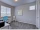 Bedroom with neutral gray walls, a desk, and a chair, offering a serene and functional space at 1031 Turnberry Cir, Louisville, CO 80027