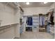 Walk-in closet features ample shelving and racks for maximum storage at 1031 Turnberry Cir, Louisville, CO 80027