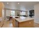 Open-concept kitchen with quartz countertops, stainless steel appliances, and seamless flow to the dining and living areas at 1031 Turnberry Cir, Louisville, CO 80027