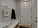Practical mud room featuring a convenient bench with hooks for organizing coats and bags near the entrance at 1031 Turnberry Cir, Louisville, CO 80027